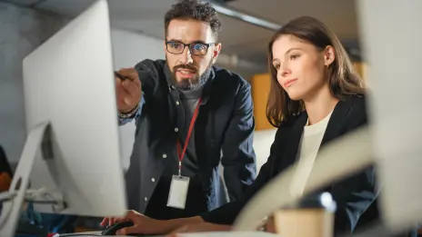 IT support worker helping a staff member